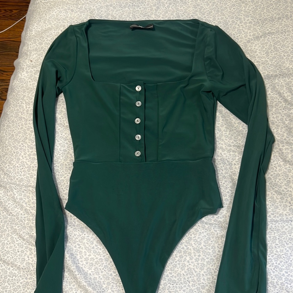 Lightly worn, green bodysuit